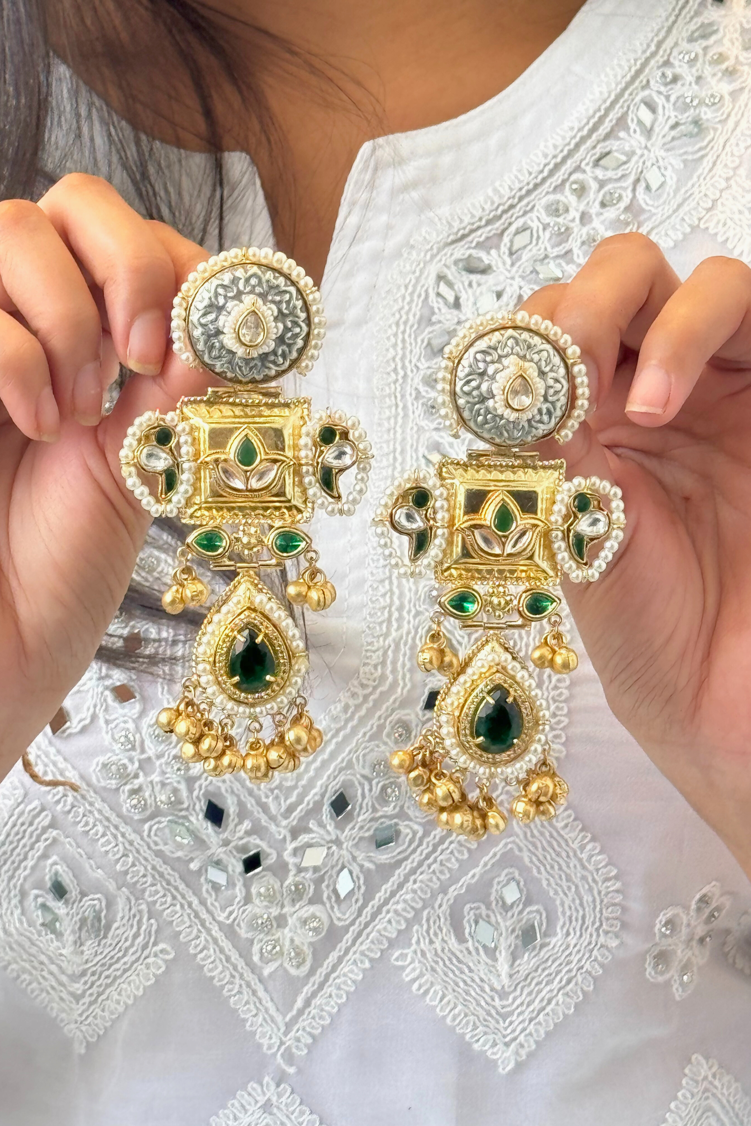 Gold and silver earrings with green stones 