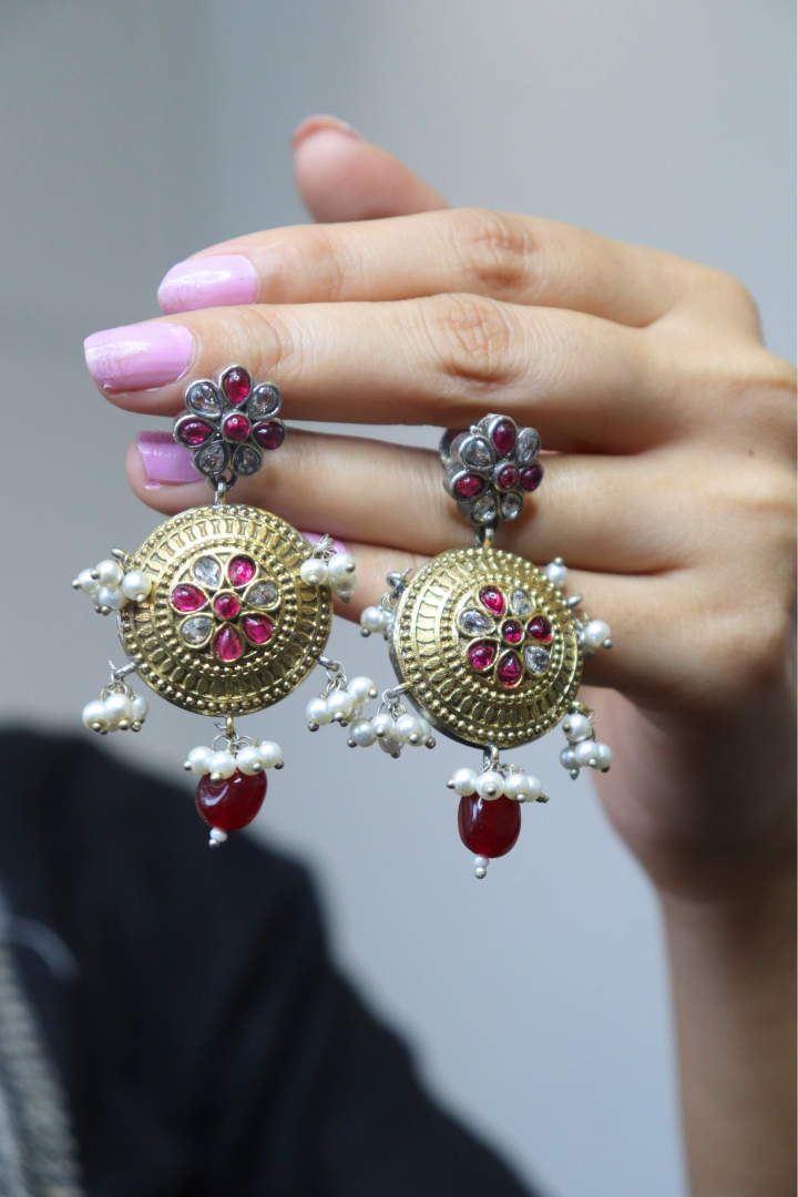 Gold earrings with red and white stones 