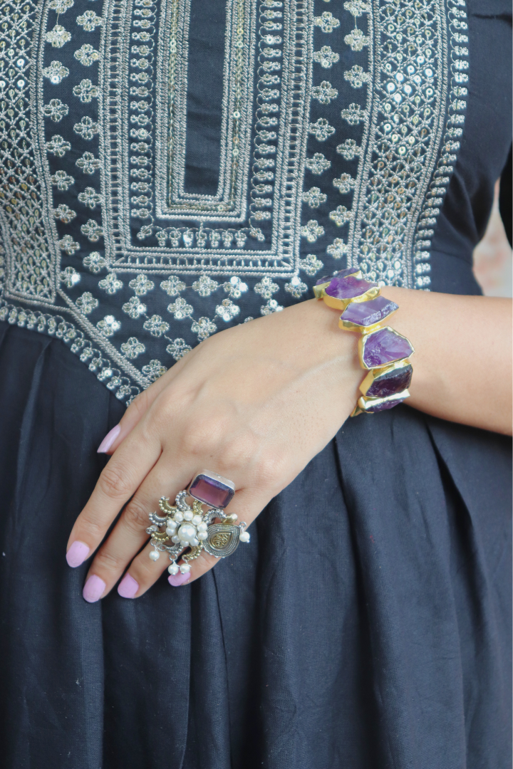 women wearing a ring and bracelet 